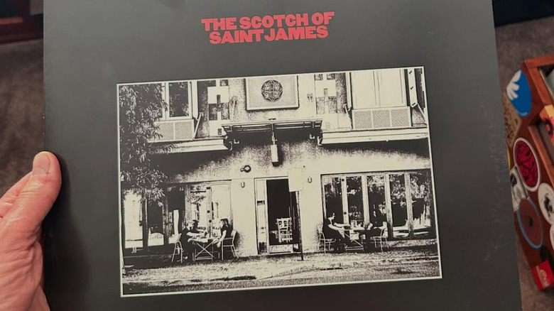 Hand holding a record sleeve entitled "The Scotch of Saint James"