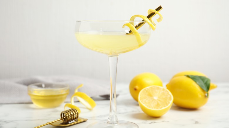 Bee sting in coupe glass with lemons