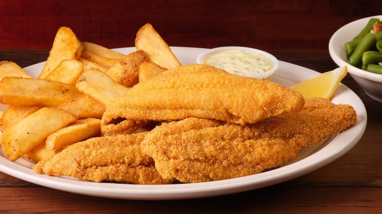 Menu image of Texas Roadhouse fried catfish with steak fries and green beans