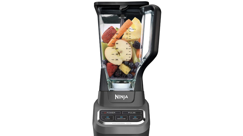 black blender with fruit inside
