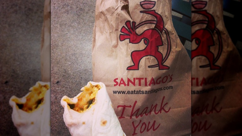 Top of breakfast burrito with bite taken out of it