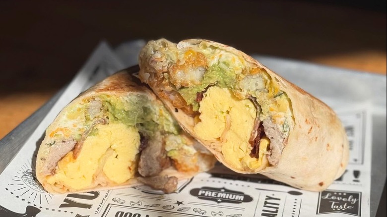 Breakfast burrito cut in half with interior shot