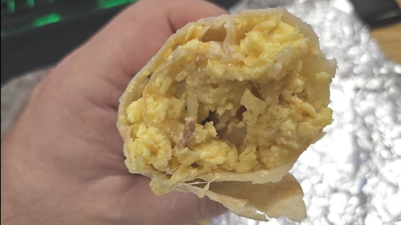 Bite taken from breakfast burrito from Jalapeños Mexican Restaurant