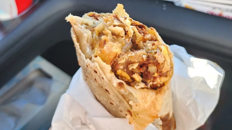 Bite taken from breakfast burrito from Chili Verde