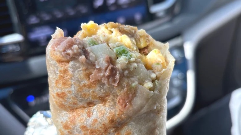 Bite taken from breakfast burrito from La Victoria