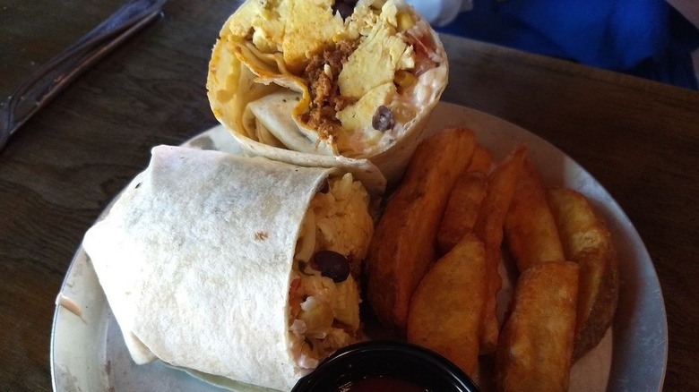 Half of a breakfast burrito from Black Sheep Burritos and Brews