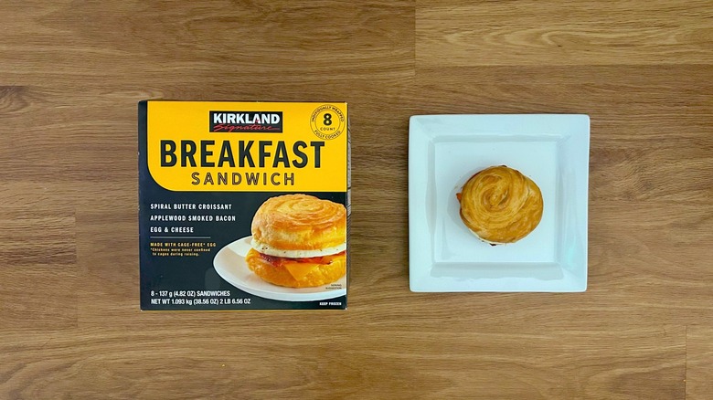 Kirkland breakfast sandwich box with cooked sandwich on plate