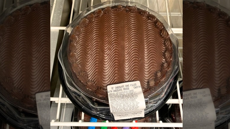 A Costco chocolate cake on a wire shelf