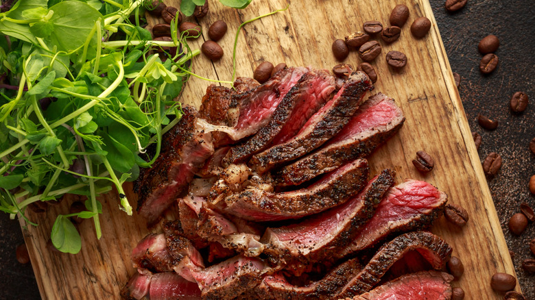 cooked steak sliced with coffee beans
