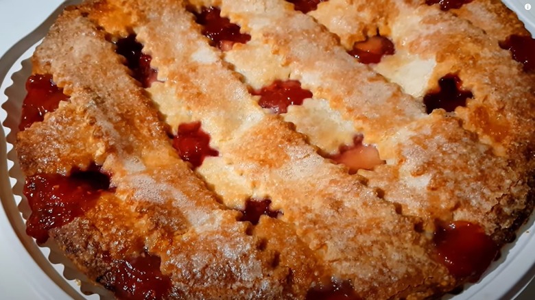 Costco apple berry pie in the plates it's packaged in