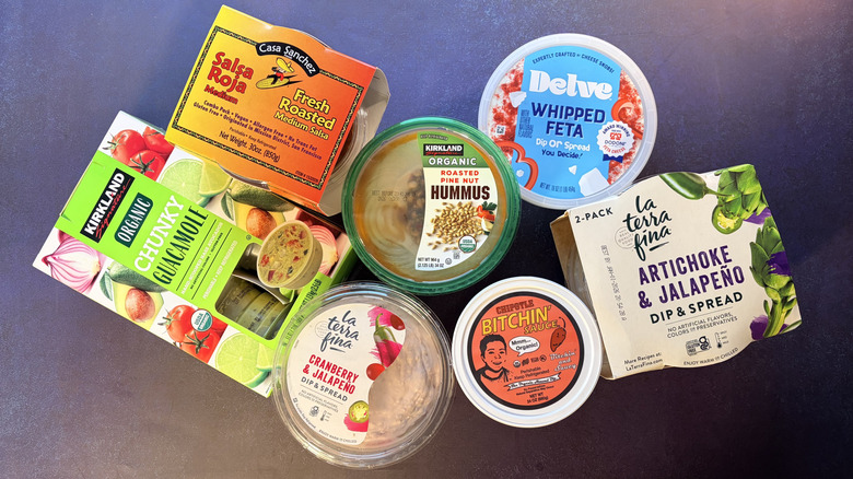Various dips from costco arranged on table