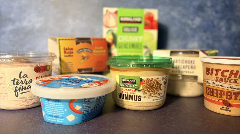 Various dips from Costco, arranged on a table