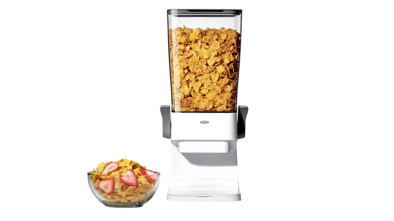 food dispenser and bowl filled with cereal