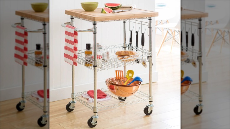 kitchen cart on wheels stored with various items and food