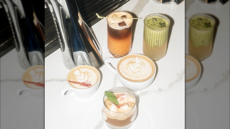 Assortment of coffee and matcha drinks on coffee bar