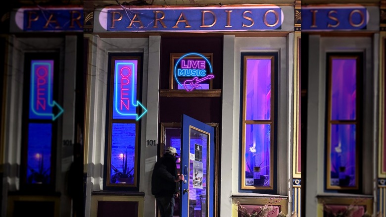 Man walking into Cafe Paradiso