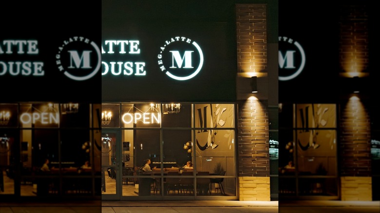 Shot of Meg-A-Latte through glass windows at night
