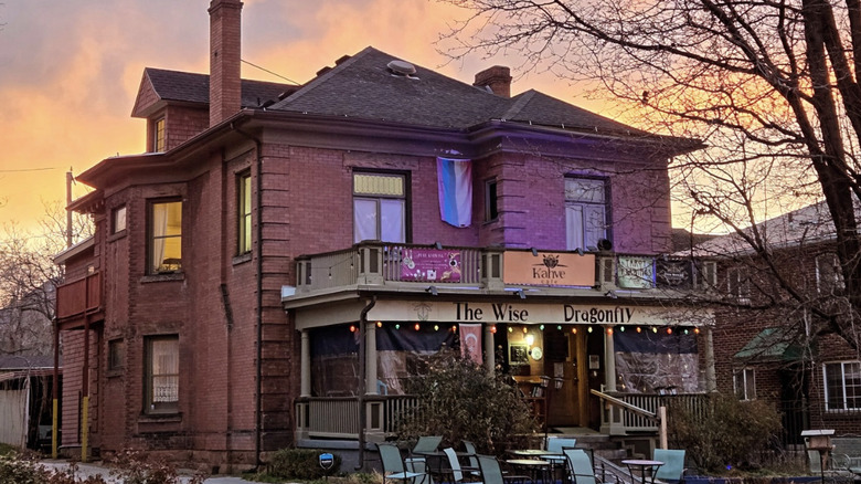 Exterior of Kahve Cafe house pictured in front of a sunset sky