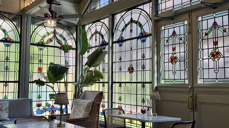 Stained glass windows and seating at The Greenhouse