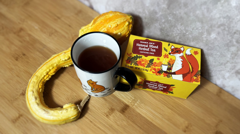 Top view of tea in cup, tea box, and gourd