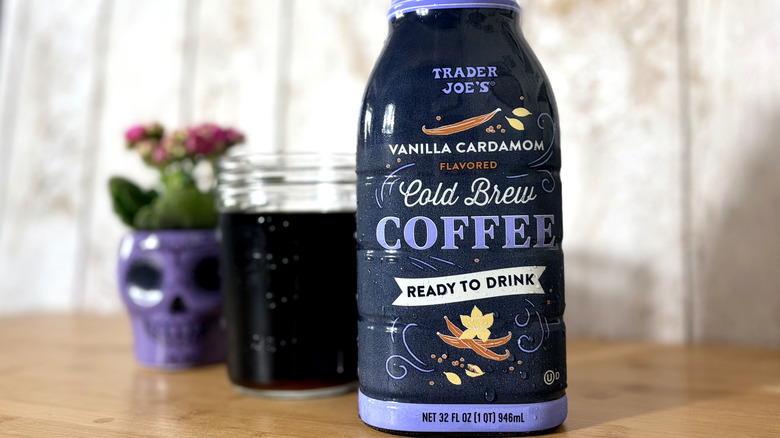 Jug and glass of cold brew coffee with skull decoration