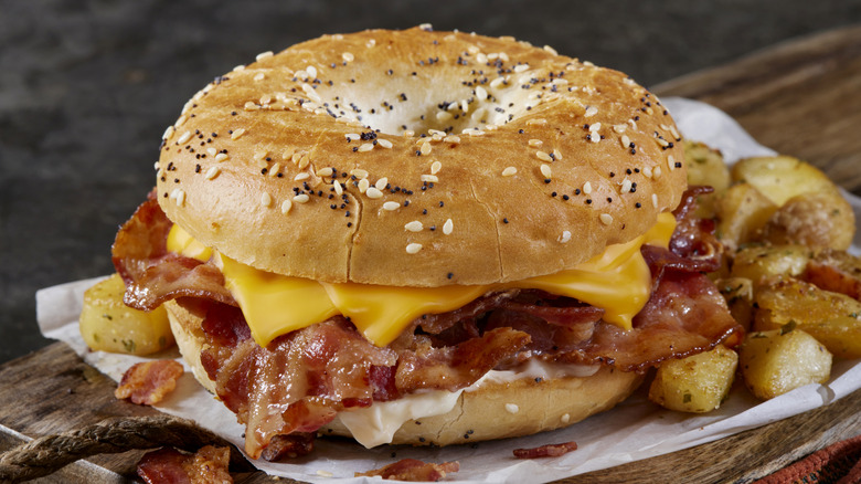 Breakfast bagel sandwich with bacon and cheese