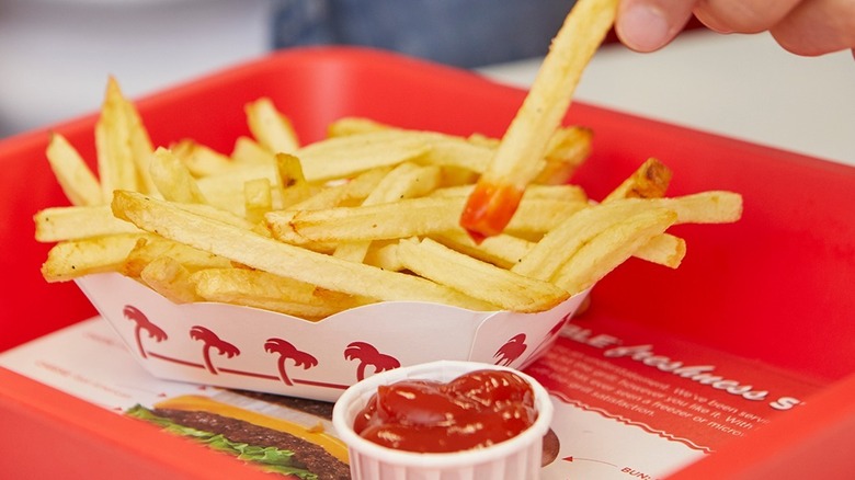 In-N-Out fry dipped into ketchup