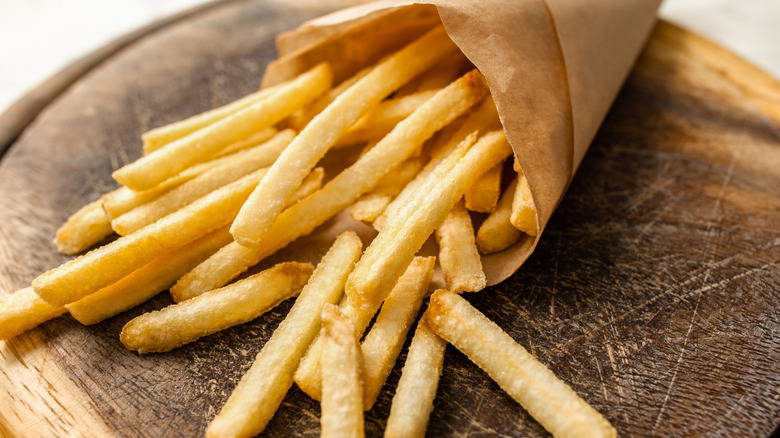 Fries wrapped in brown paper