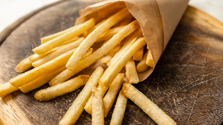 Fries wrapped in brown paper