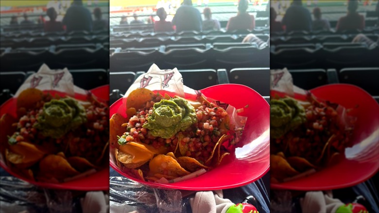 An angels helmet filled with nachos in the ballpark stands