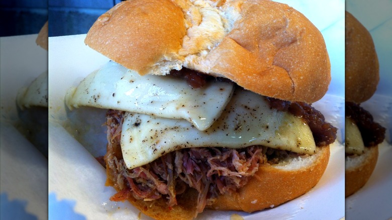 A close up of pulled pork pierogi sandwich