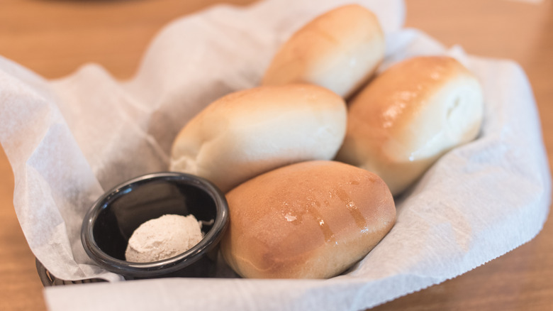 Close up of Texas Roadhouse rolls and honey cinnamon butter