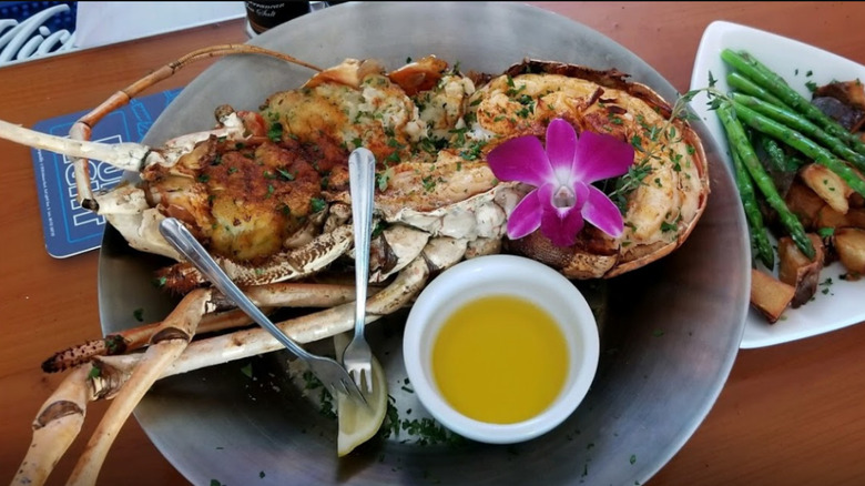 Seafood dish with butter on a metal plate
