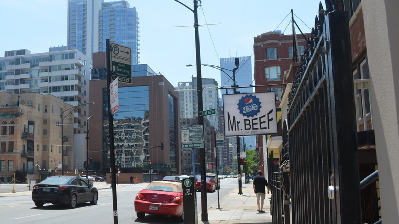 The exterior of Mr. Beef in Chicago, showing the sidewalk outside and its restaurant sign