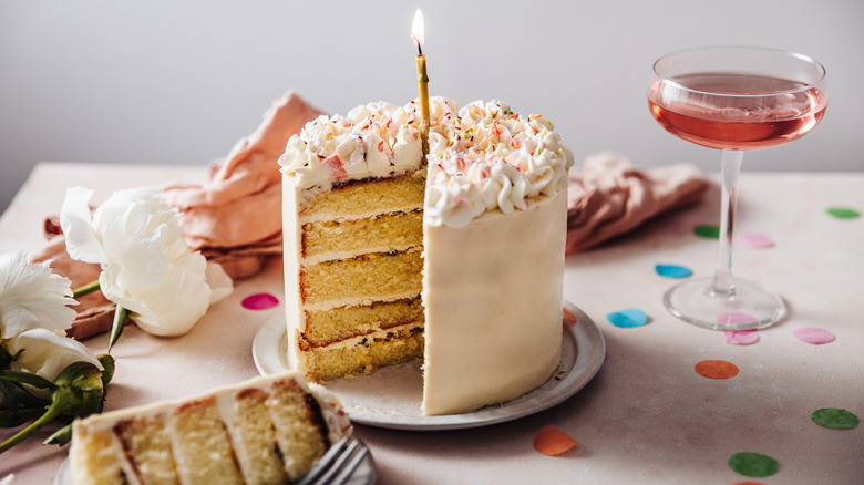 Sliced birthday layer cake on a plate