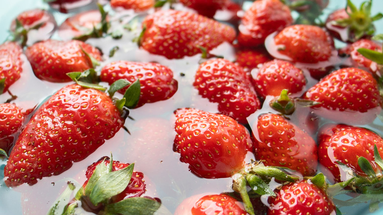 strawberries soaking in water