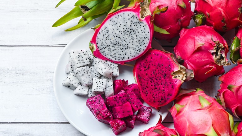 Sliced pink and white dragon fruit on plate