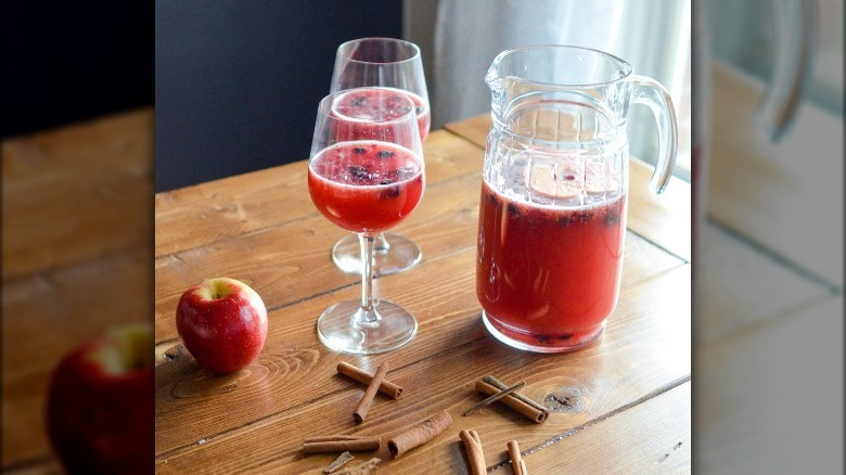 Jug of cocktail and glasses