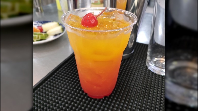 Tequila Sunrise in plastic cup