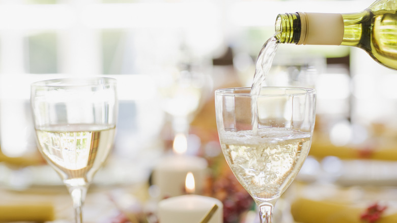 White wine pouring into glass