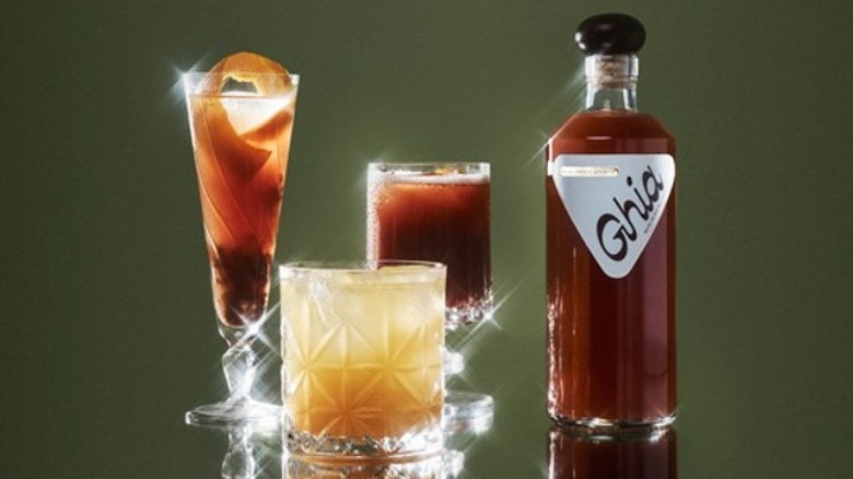 Ghia bottle with cocktail glasses