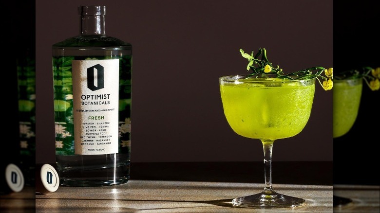 Optimist bottle and green cocktail
