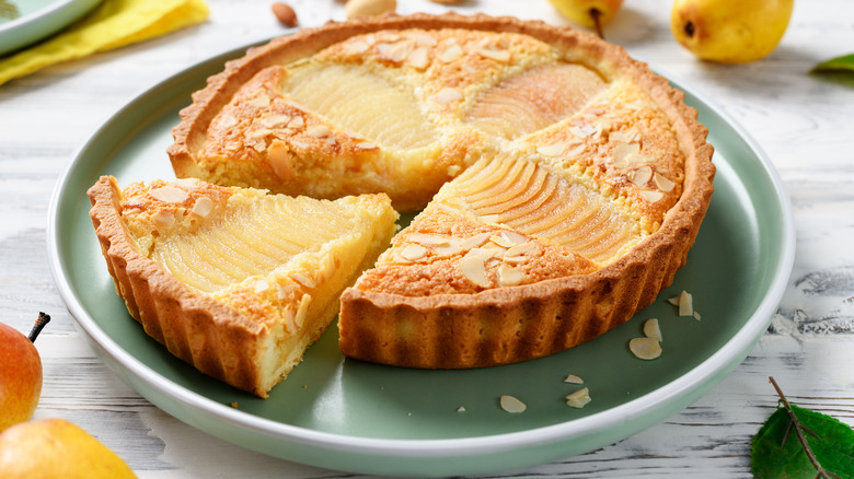 Close up picture of a pear baked good on a plate