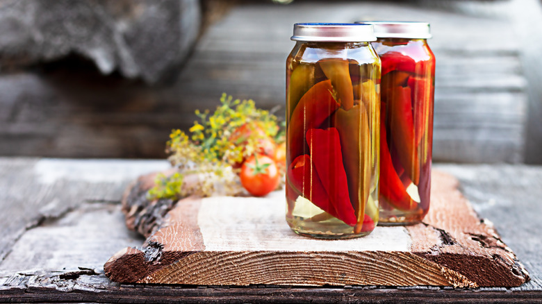 Peppers and vinegar in jars 