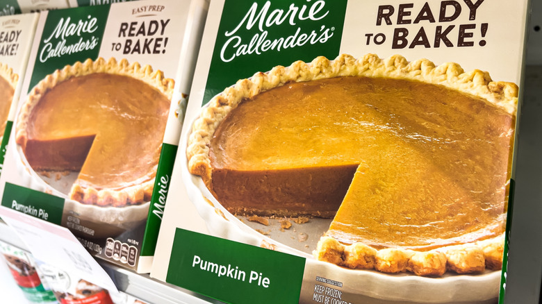 Boxes of Marie Callender's Pumpkin Pie on a store shelf.
