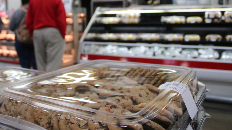 Variety of cookies in front of a grocery store bakery.