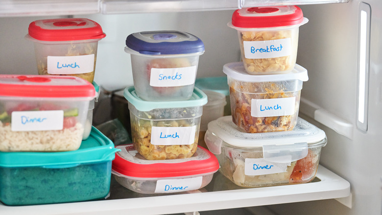 Plastic containers containing food in the fridge
