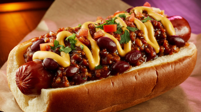A hot dog topped with chili and cheese