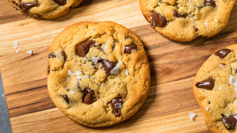 Chocolate chip cookies with sea salt on a wooden board