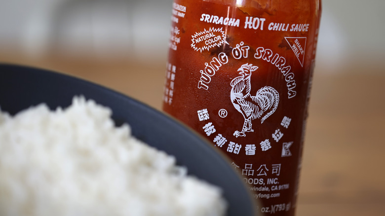 closeup of Sriracha and rice 